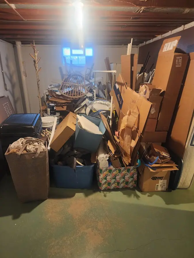 Roll-off dumpster container at job site for Construction Dumpster Rental in Hartland